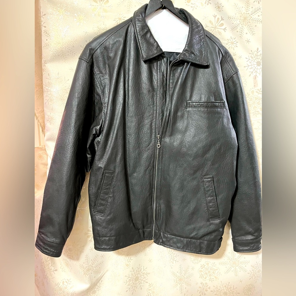 Mens black leather jacket. Size L. Great condition. Pockets snaps at wrist